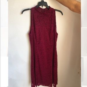 High-collared maroon lace dress